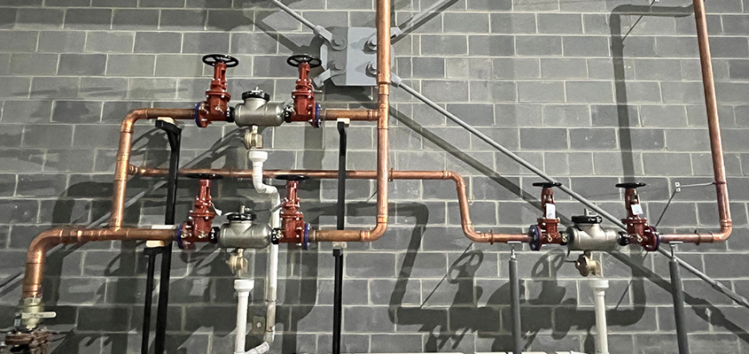 plumbing pipes again concrete wall
