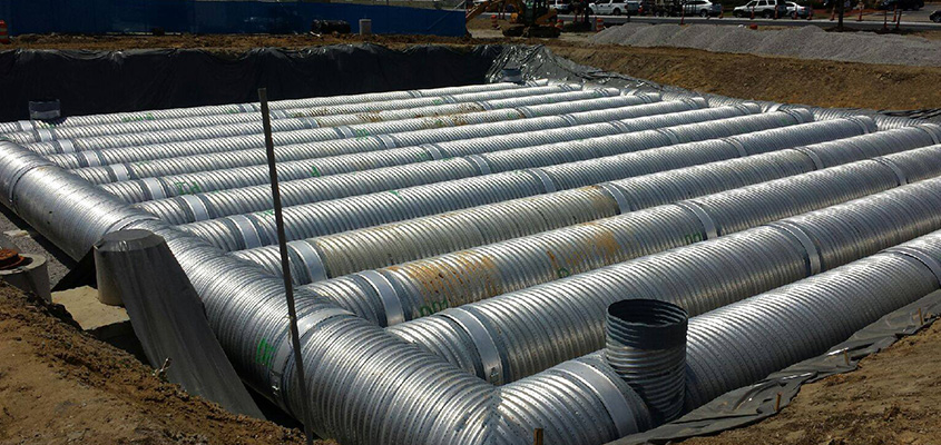 underground piping being worked on to manage stormwater